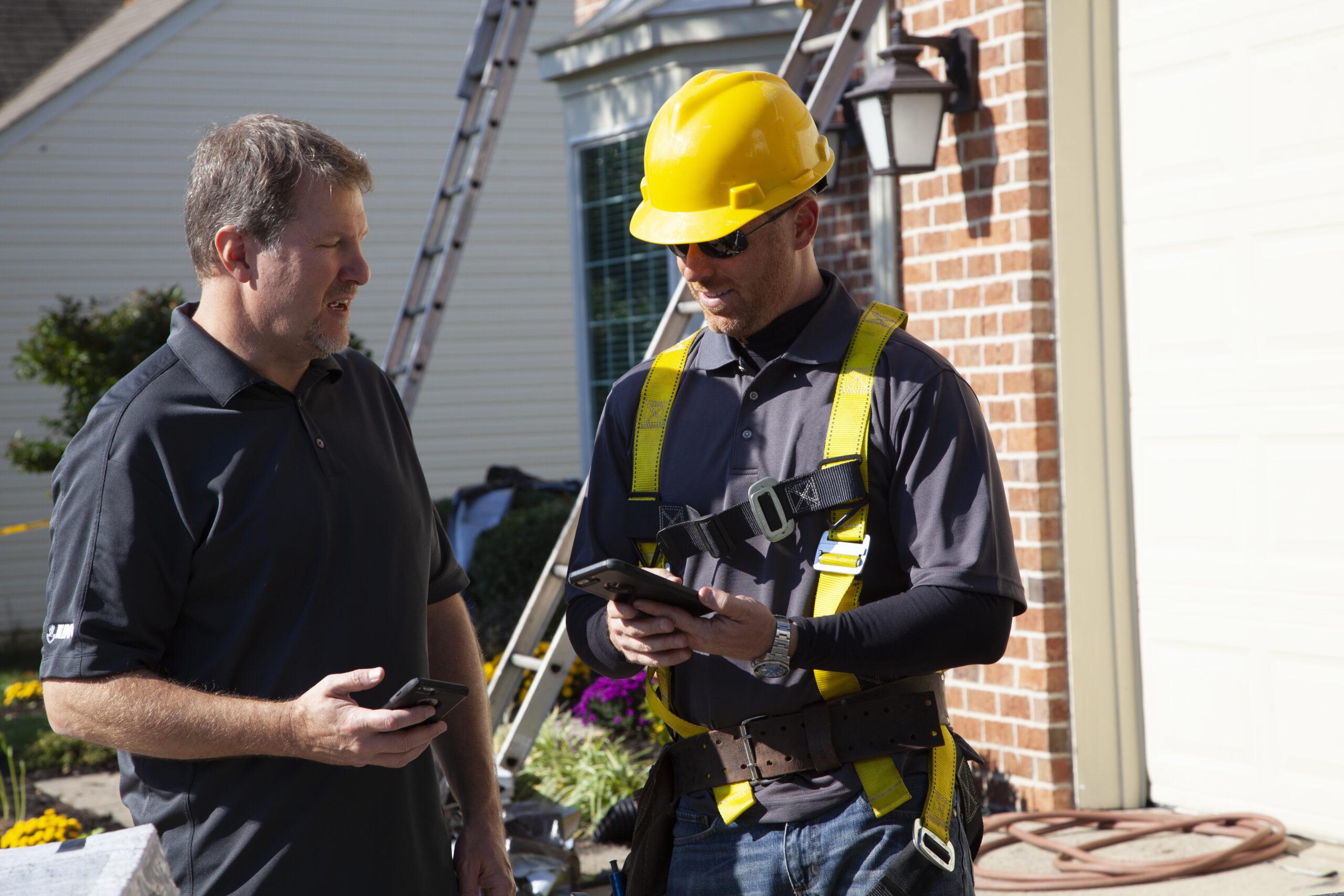 Technician locating and repairing a roof leak